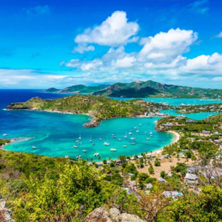 Beautiful port at antigua, with blue seas and tropical landscape.