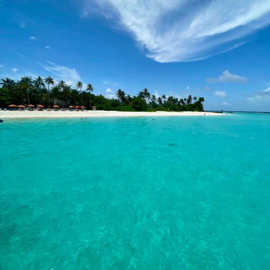 Blue seas and blue skies in the Maldives.