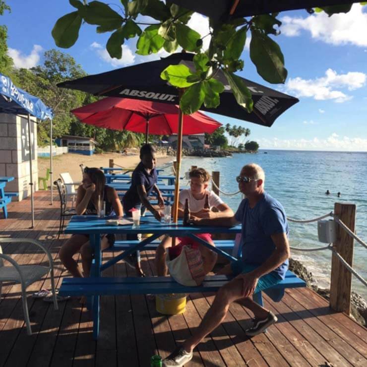 Enjoying dinner on the decking overlooking the ocean in barbados.