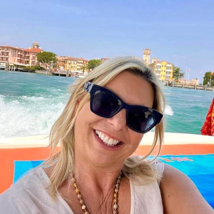 Enjoying the sun by the water on holiday in Italy.