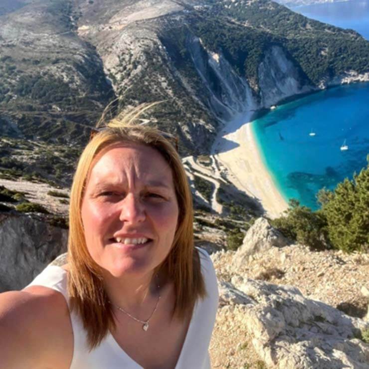 Holiday selfie with the backdrop of rock cliffs, sandy beachs and beautiful blue sea in Kefalonia.
