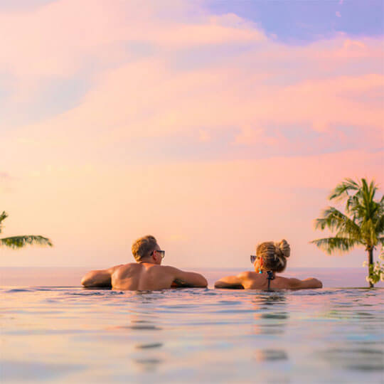 Lounging in the pool on a luxury honeymoon holiday.