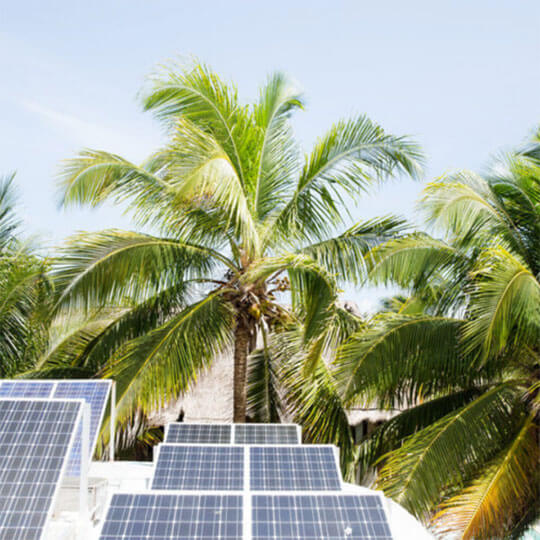 Solar panels on hotels that advocate for sustainable tourism.