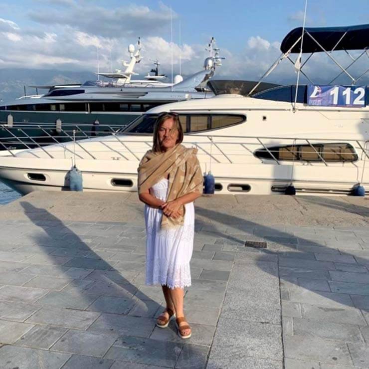 Standing in the port of corsica in front of a luxury holiday yacht.