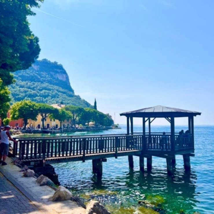 Breathtaking view of an historic jetty on the water in Italy.