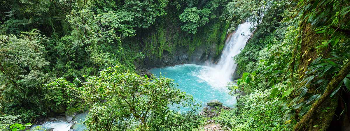 Waterfall in the lush green rainforest on holiday in Costa Rica.