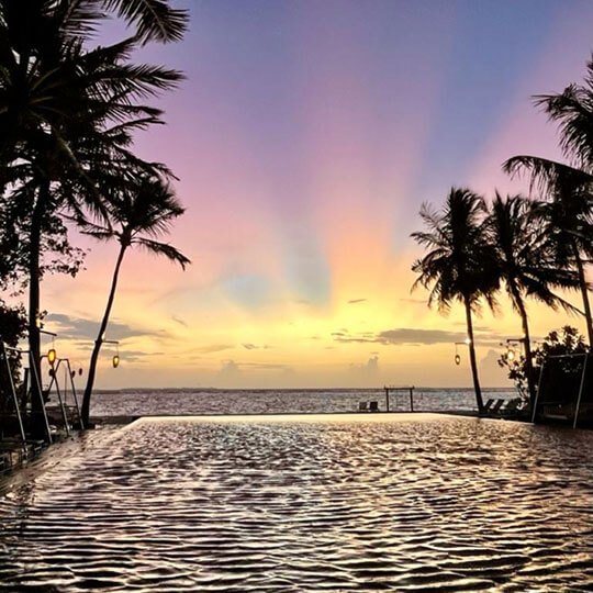 Stunning sunset over the water in the Maldives.