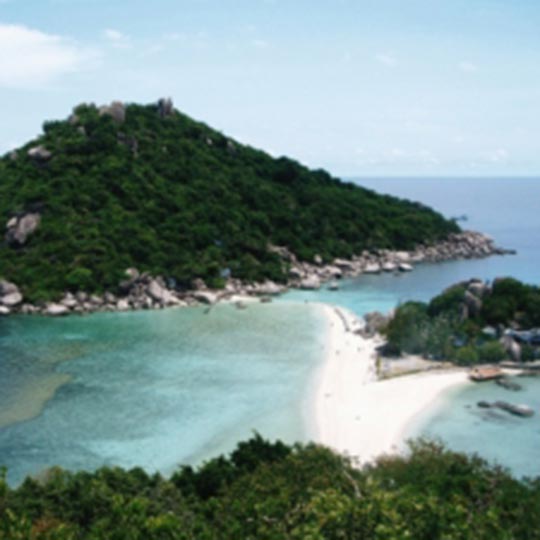 Thai islands surrounded by crystal clear blue ocean.
