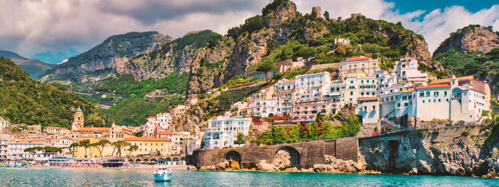 Amalfi Coast town perched on cliffs above turquoise waters, southern Italy