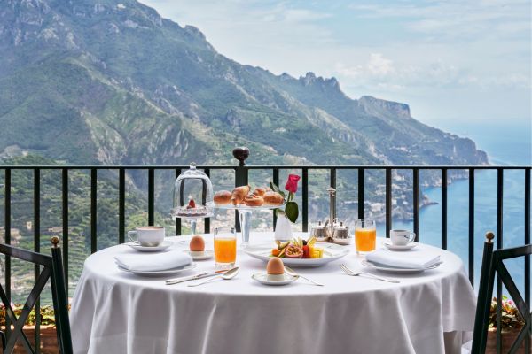 Terrace breakfast table at Palazzo Avino with panoramic Amalfi Coast mountain views