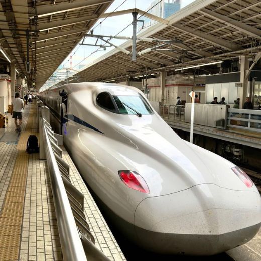 Japanese bullet train Shinkansen waiting at station platform